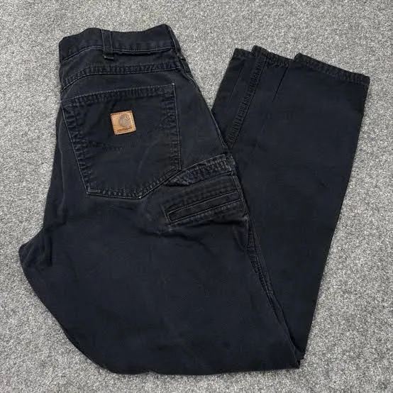 Carhartt label on black canvas work pants