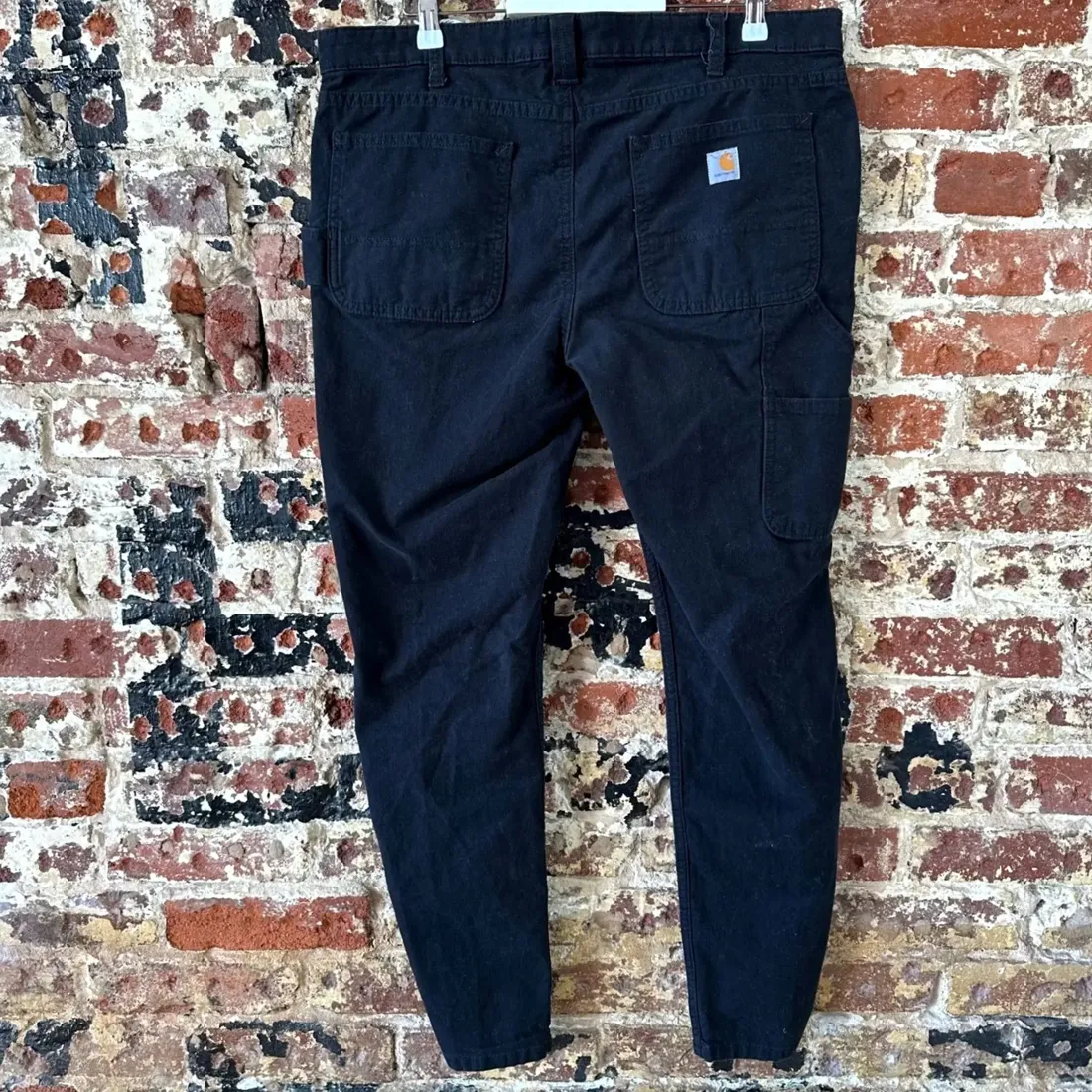 Black vintage Carhartt canvas work pants detail