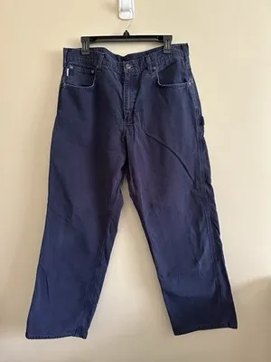 Vintage Carhartt Canvas Work Pants — Navy Blue — full view, broken in condition