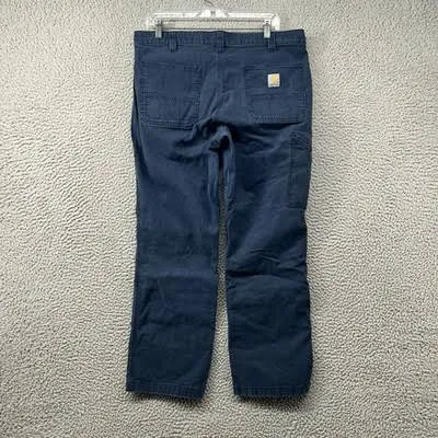 Carhartt label on navy blue canvas work pants