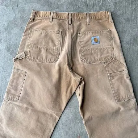 Vintage Carhartt Duck Carpenter Pants — Desert Tan — full view, slightly worn condition