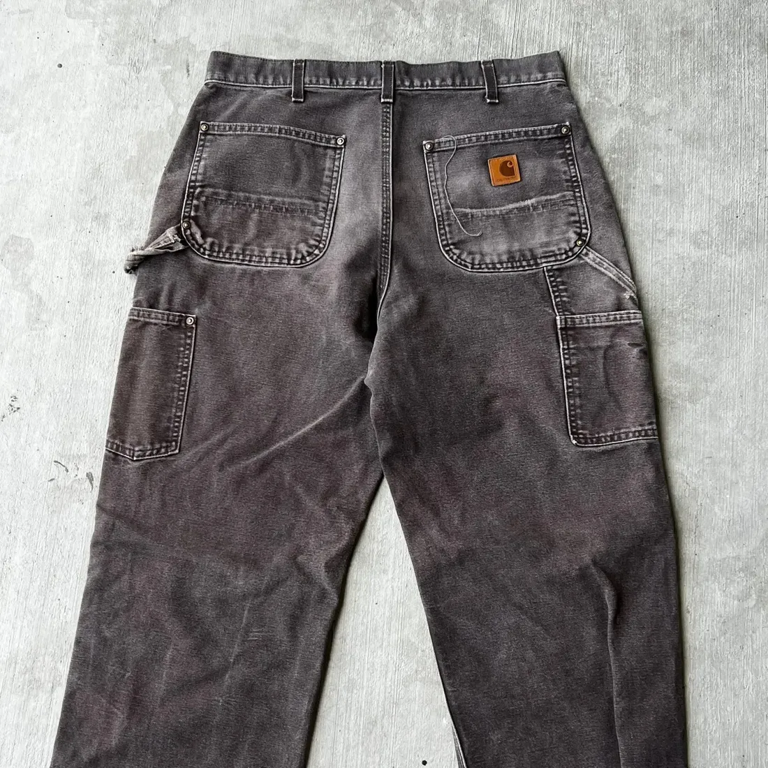 Vintage Carhartt Duck Carpenter Work Pants — Faded Black — full view, slightly worn condition