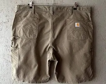 Vintage Carhartt Canvas Carpenter Shorts — Dark Khaki — full view, broken in condition