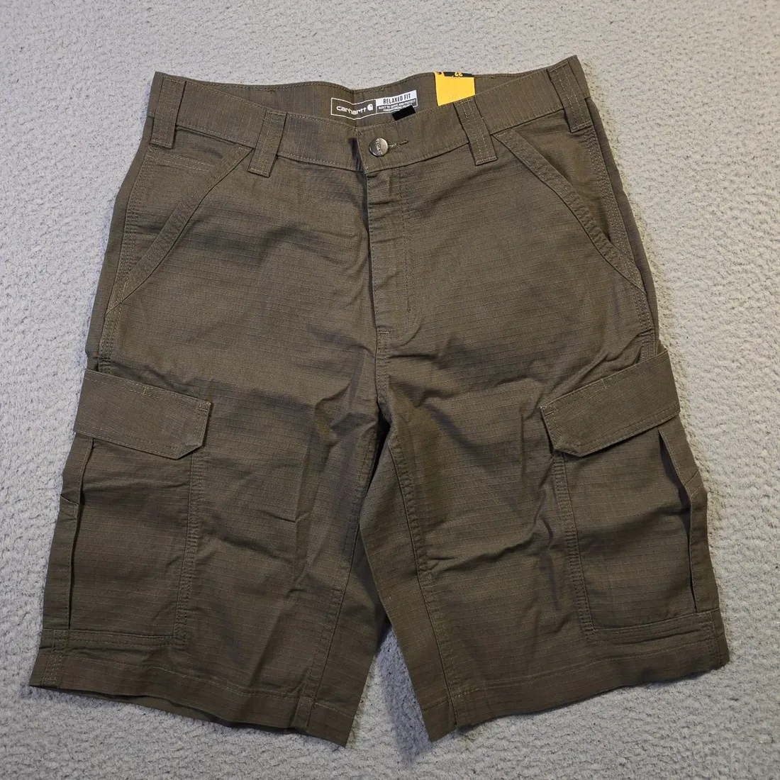 Vintage Carhartt Ripstop Cargo Work Shorts — Dark Olive — full view, slightly worn condition