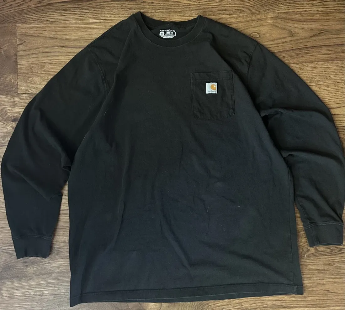 Vintage Carhartt Long Sleeve Pocket T Shirt — Black — full view, broken in condition